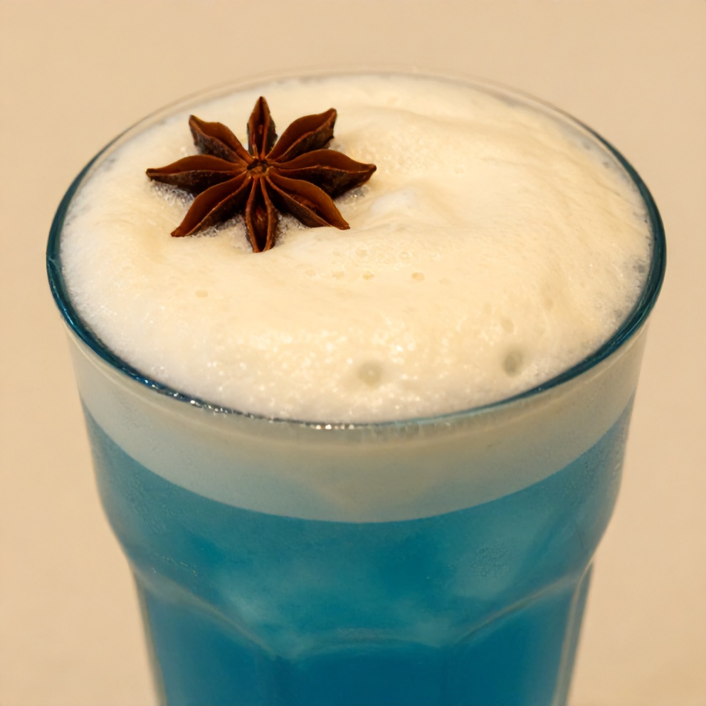 Iced Blue Tea Latte with Vanilla Cold Foam in a Glass